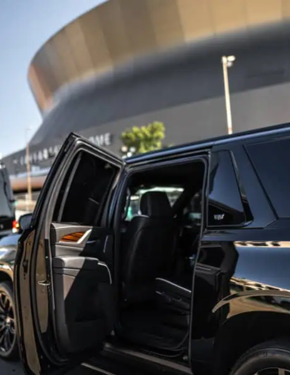 black SUV parked outside business venue for corporate transportation New Orleans