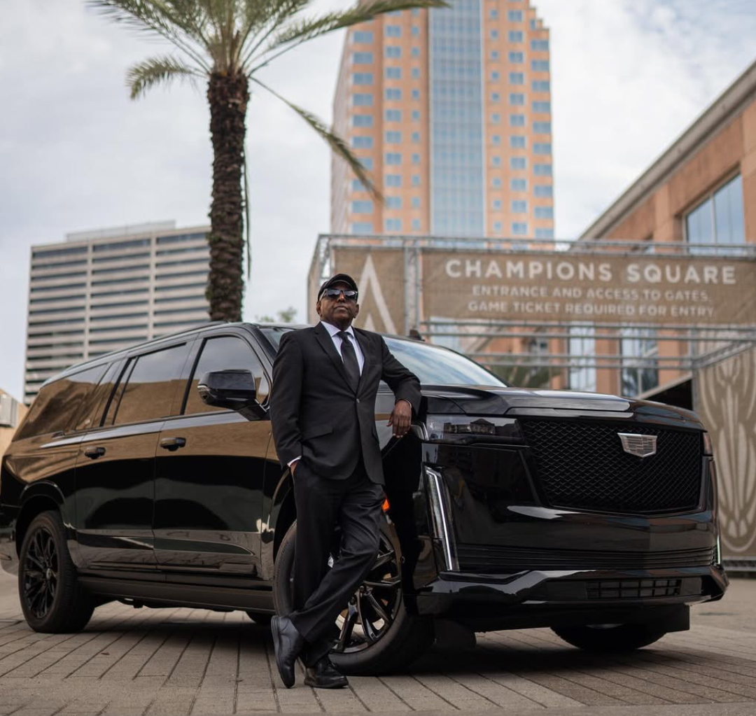 Chauffeur opening the door of a luxury vehicle in New Orleans